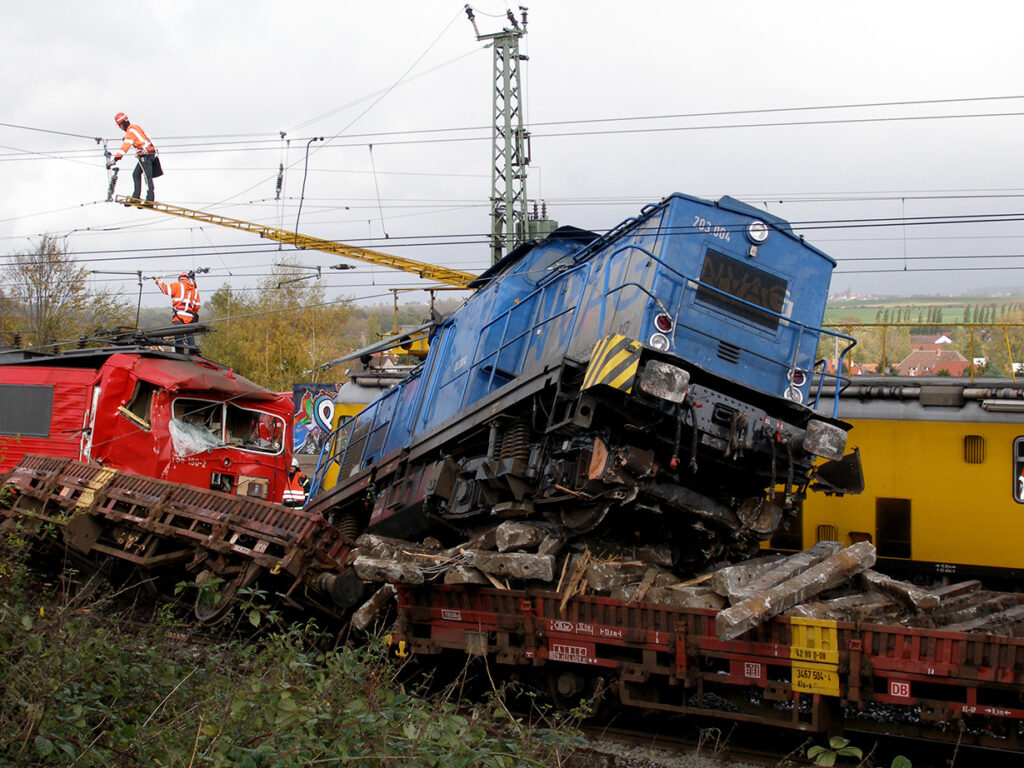 Two crushed trains that collided and derailed. Railroad accidents can be catastrophic but a Houston railroad accident lawyer can help you get the justice you deserve.