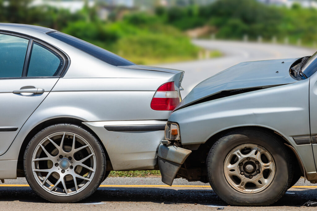Two car accident on road. If you’ve been injured in a car crash, our Houston car accident lawyers can help you recover the compensation you deserve.
