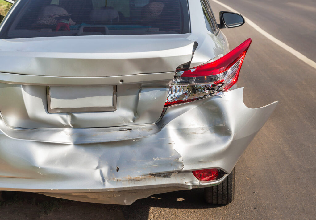 Damaged rear end of car from car crash. Owner needs a car accident lawyer/