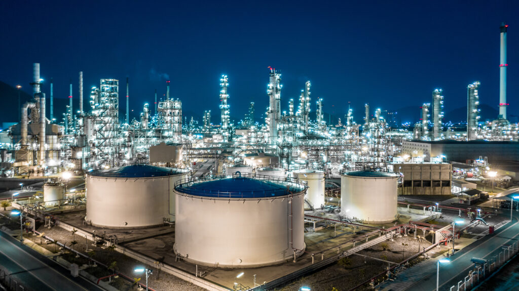 Chemical plant at night. If you’ve been injured while working at a chemical plant or refinery, contact out Houston plant & refinery accident attorneys.