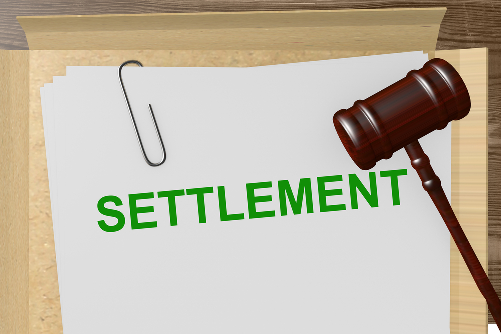Illustration of a person weighing a low settlement offer on one side and a fair compensation on the other; Navigating Low Settlement Offers