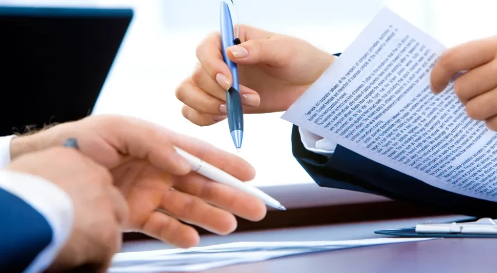 Two lawyers working on a clients paperwork.