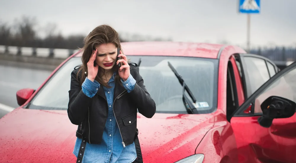 A person calling the police after an accident.